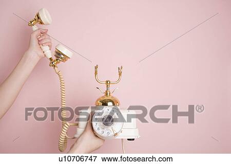 Woman's hands holding telephone View Large Photo Image Stock Photo - Woman's hands holding telephone. Fotosearch