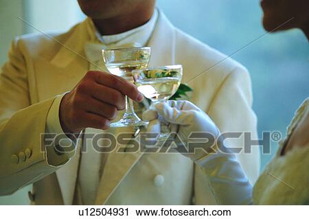 Bride and groom toasting View Large Photo Image Stock Image - Bride and groom toasting. Fotosearch