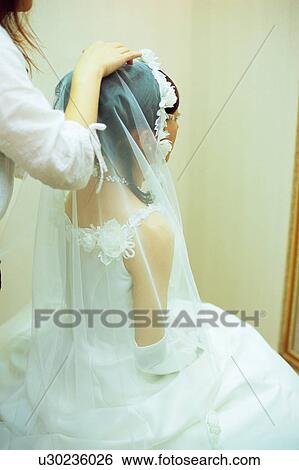 Hairstylist doing hair of bride View Large Photo Image Stock Photograph - Hairstylist doing hair of bride. Fotosearch