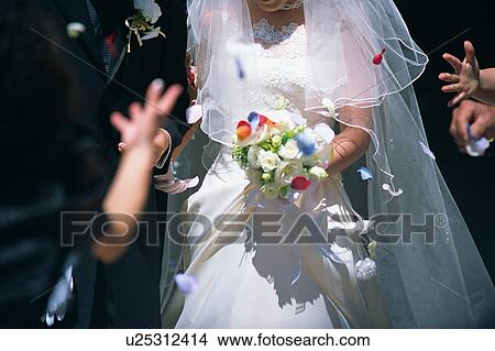 Picture - Midsection of bride and groom. Fotosearch