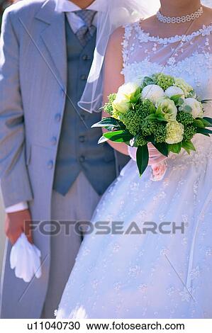Midsection of bride and groom View Large Photo Image Stock Image - Midsection of bride and groom. Fotosearch