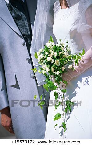 Midsection of bride and groom View Large Photo Image Stock Image - Midsection of bride and groom. Fotosearch