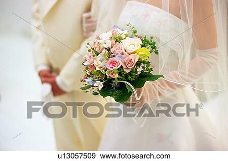 Midsection of bride and groom View Large Photo Image Stock Photo - Midsection of bride and groom. Fotosearch