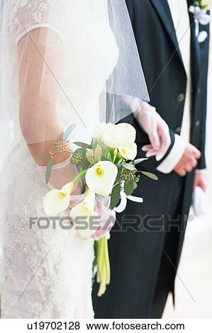 Midsection of bride and groom View Large Photo Image Stock Photo - Midsection of bride and groom. Fotosearch