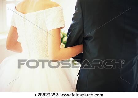Rear view of bride and groom View Large Photo Image Stock Image - Rear view of bride and groom. Fotosearch