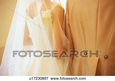 Rear view of bride and groom View Large Photo Image Stock Photo - Rear view of bride and groom. Fotosearch