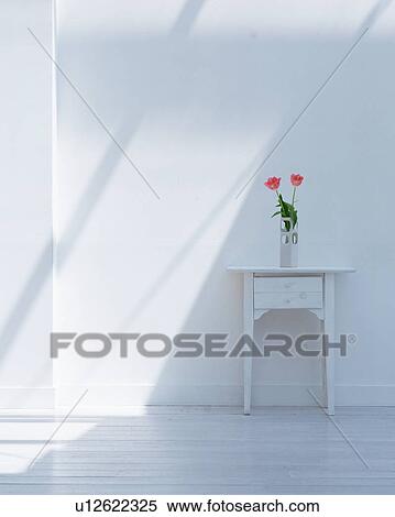 Stock Photography - A flower vase on wooden table. Fotosearch