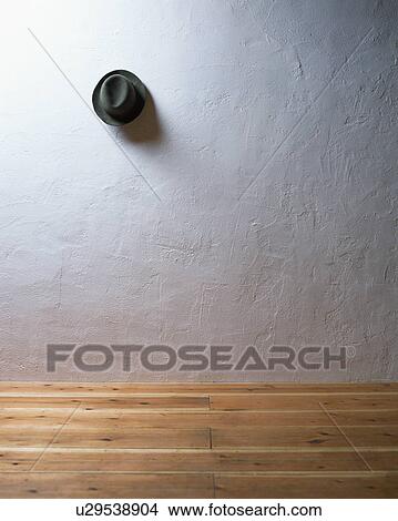 A hat hung on wall View Large Photo Image Picture - A hat hung on wall. Fotosearch