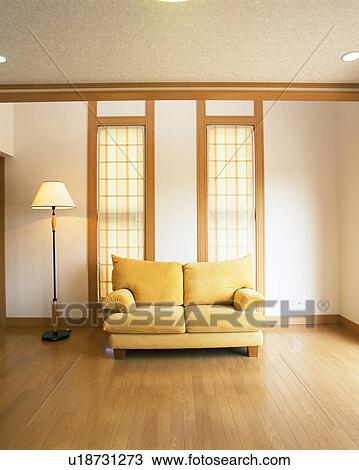 A lamp and sofa in living room View Large Photo Image Stock Image - A lamp and sofa in living room. Fotosearch