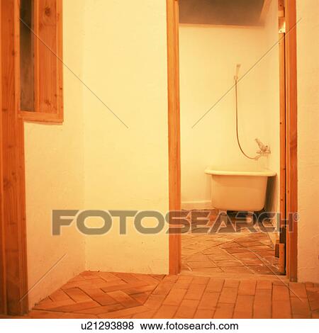 A white bathtub on brick wall View Large Photo Image Stock Photo - A white bathtub on brick wall. Fotosearch