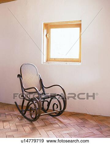 A wooden rocking chair View Large Photo Image Stock Photo - A wooden rocking chair. Fotosearch