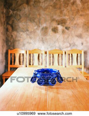 An elegant blue container with cups on table View Large Photo Image Stock Photo - An elegant blue container with cups on table. Fotosearch