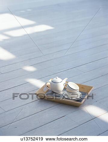 Cups, saucers and a pot kept in a wooden tray View Large Photo Image Stock Photo - Cups, saucers and a pot kept in a wooden tray. Fotosearch