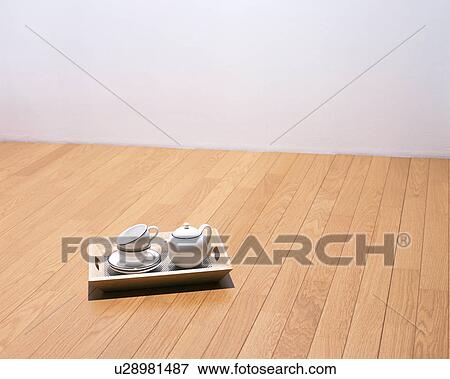 Cups, saucers and a pot kept in a wooden tray View Large Photo Image Stock Photo - Cups, saucers and a pot kept in a wooden tray. Fotosearch