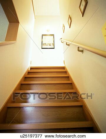 Low angle view of a wooden staircase of a house View Large Photo Image Stock Photo - Low angle view of a wooden staircase of a house. Fotosearch