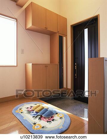 Pairs of slippers placed on foot mat at entrance View Large Photo Image Stock Photo - Pairs of slippers placed on foot mat at entrance. Fotosearch