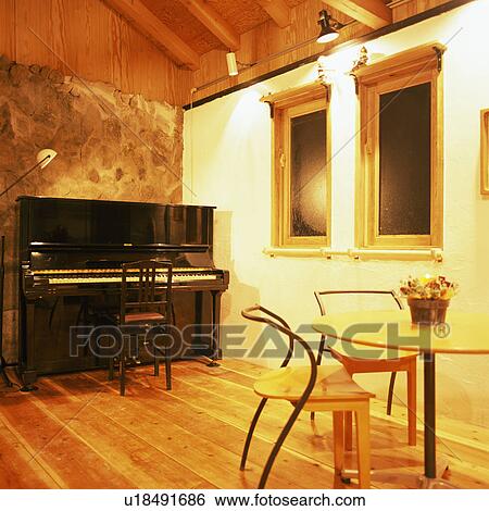 Piano in a room View Large Photo Image Stock Photograph - Piano in a room. Fotosearch