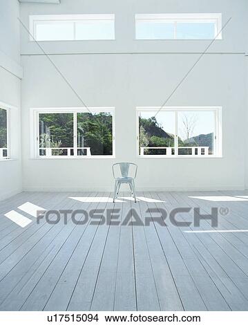 Picture - Single chair on floor. Fotosearch