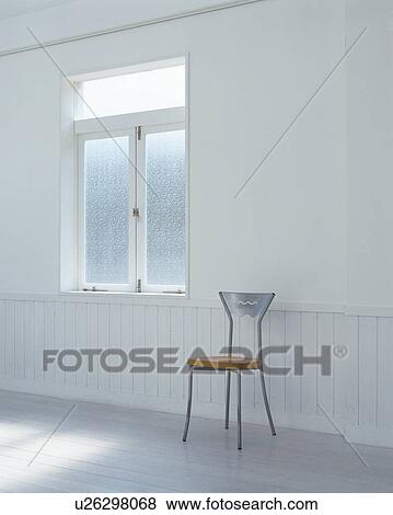Stock Photo - Single chair on floor. Fotosearch