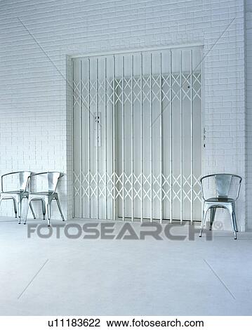 Three chairs placed outside of an elevator View Large Photo Image Stock Image - Three chairs placed outside of an elevator. Fotosearch