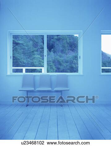 Stock Image - Three seats set against wall. Fotosearch