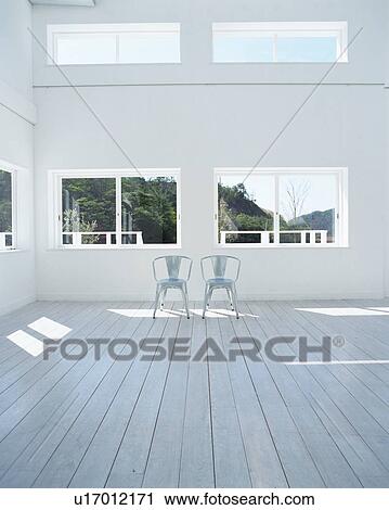 Stock Image - Two chairs on floor. Fotosearch