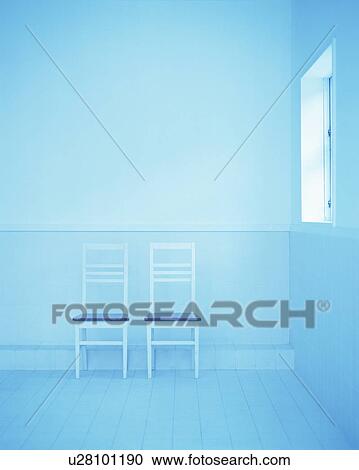 Stock Image - Two chairs on floor. Fotosearch