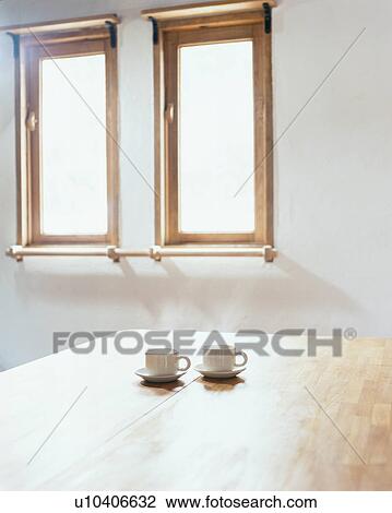 Two cups and saucers on table View Large Photo Image Stock Image - Two cups and saucers on table. Fotosearch