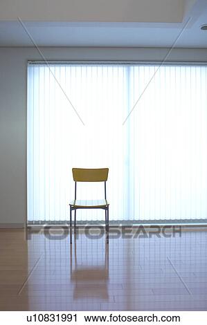 A chair in a room View Large Photo Image Stock Image - A chair in a room. Fotosearch