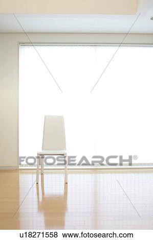A chair in a room View Large Photo Image Stock Photo - A chair in a room. Fotosearch