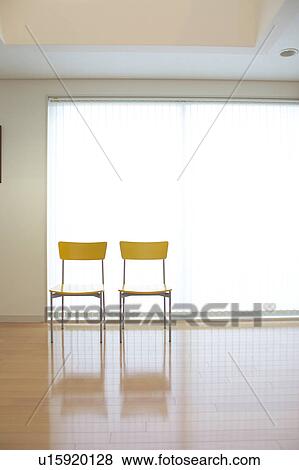 Two chairs in a room View Large Photo Image Stock Photo - Two chairs in a room. Fotosearch