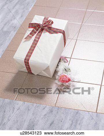 Stock Image - Gift box and flower. Fotosearch