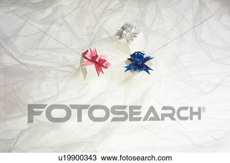 Stock Image - Small boxes with ribbons. Fotosearch