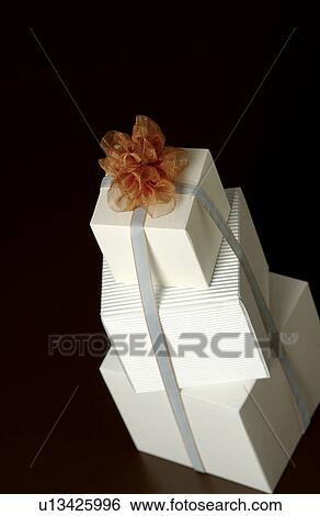 Stock Photograph - Three gift boxes with ribbon. Fotosearch