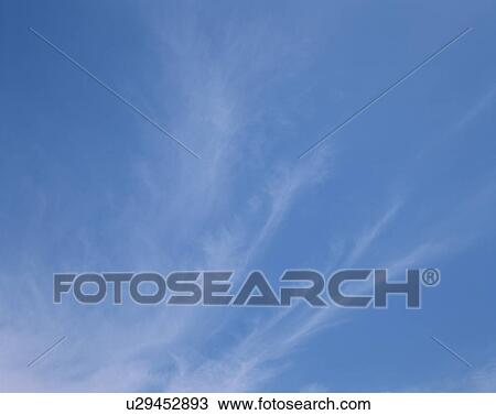 Stock Image - Blue sky filled with cirrus clouds, Maldives. Fotosearch