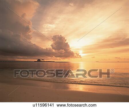 Cloudy sky at sunset in Maldives View Large Photo Image Stock Image - Cloudy sky at sunset in Maldives. Fotosearch
