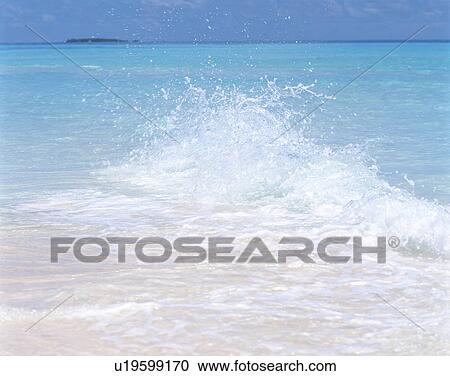 Stock Image - High surfs in Maldives. Fotosearch