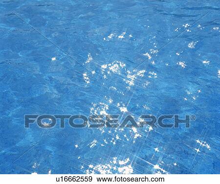 Sunlight reflected on surface of sea in Tahiti View Large Photo Image Stock Photo - Sunlight reflected on surface of sea in Tahiti. Fotosearch