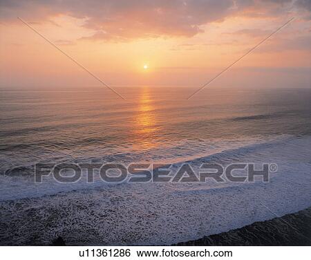 Stock Photograph - Sunset in Bali, Indonesia. Fotosearch