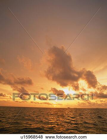 Stock Photo - Sunset in Maldives. Fotosearch