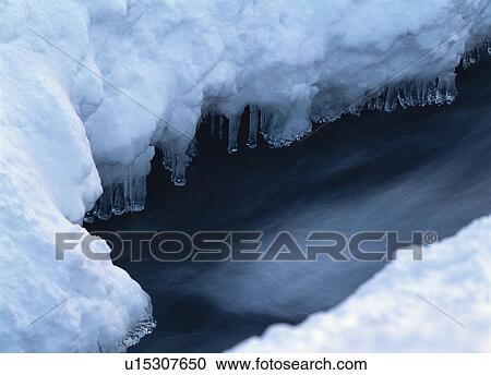 Stock Image - River covered by ice. Fotosearch