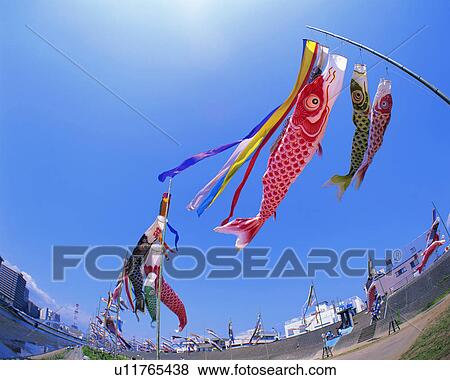 Stock Photo - Low angle view of windsocks mounted on masts. Fotosearch