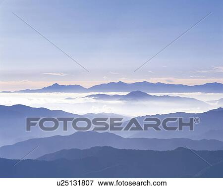 Stock Photo - Silhouette of mountains seen under sky. Fotosearch