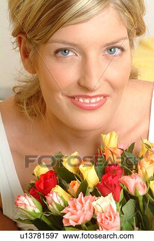 Portrait of Woman with bouquet of roses View Large Photo Image Stock Photo - Portrait of Woman with bouquet of roses. Fotosearch