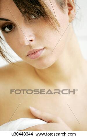 Portrait of young naked woman in bathroom, decollete Stock 