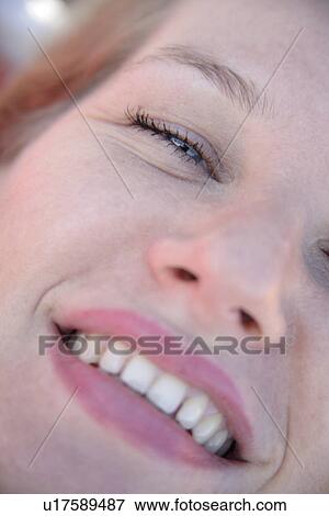 Young woman smiling, portrait, close up View Large Photo Image Stock Photo - Young woman smiling, portrait, close up. Fotosearch
