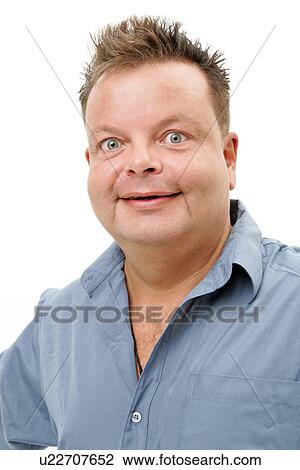 Stock Image - Overweight man smiling, portrait. Fotosearch