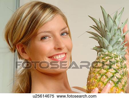 Stock Photography - Portrait of Woman with pineapple. Fotosearch