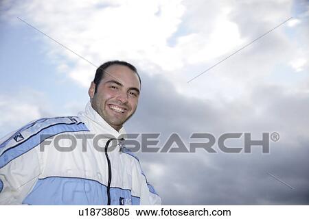 Young male jogger walking in sweatsuit outdoors View Large Photo Image Stock Photography - Young male jogger walking in sweatsuit outdoors. Fotosearch