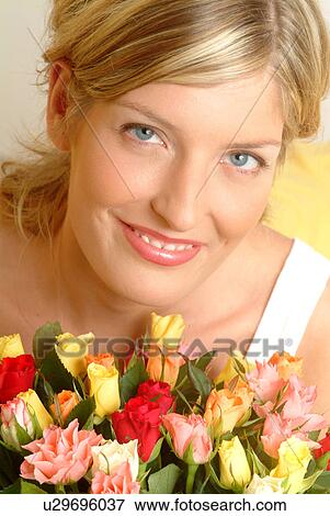Portrait of Woman with bouquet of roses View Large Photo Image Stock Photo - Portrait of Woman with bouquet of roses. Fotosearch